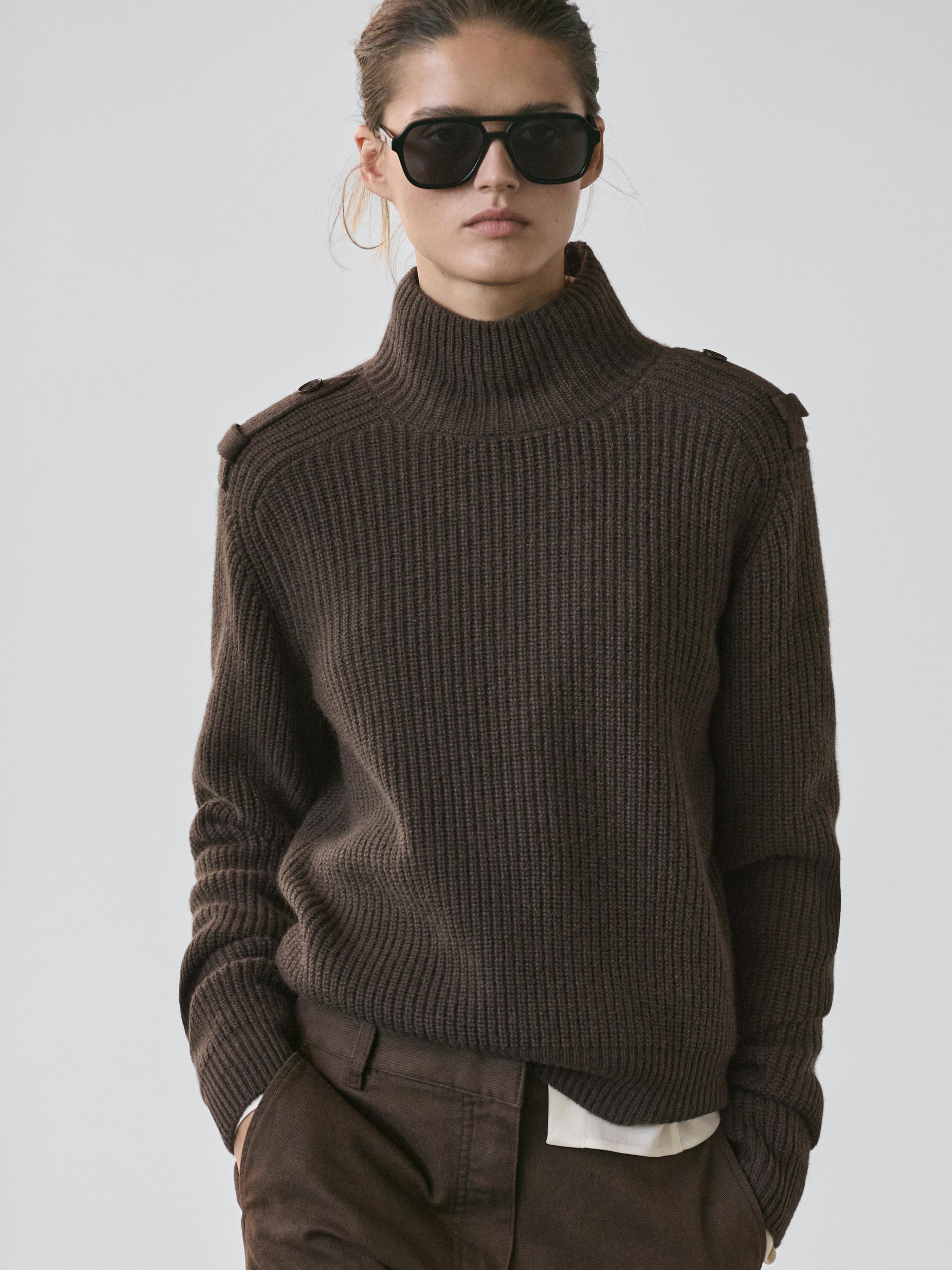 Knit sweater with shoulder detail